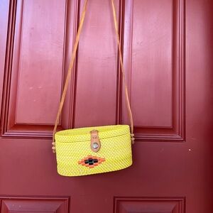 Yellow wicker bag with snap